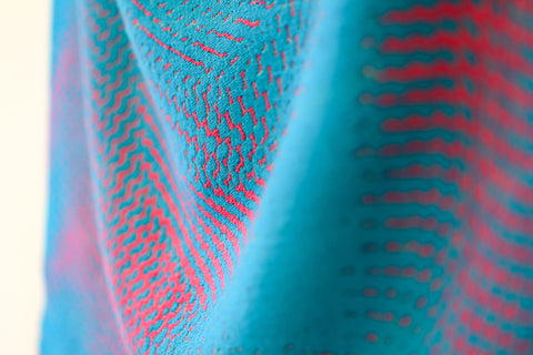 Close-up of fabric with pink and blue pattern